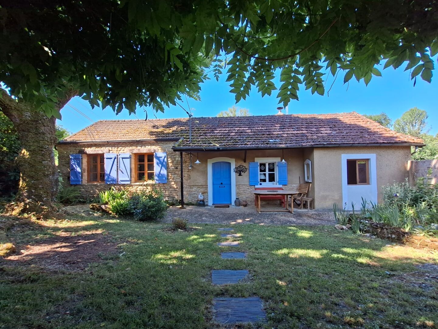 A charming old house with a small outbuilding in a small hamlet