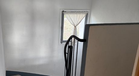 Immeuble de rapport évolutif de 200 m2 habitable avec garages, jardin et potentiel d’aménagement