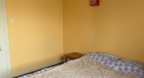 Immeuble de rapport évolutif de 200 m2 habitable avec garages, jardin et potentiel d’aménagement