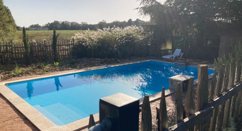 Property with two cottages, a main house, and two swimming pools